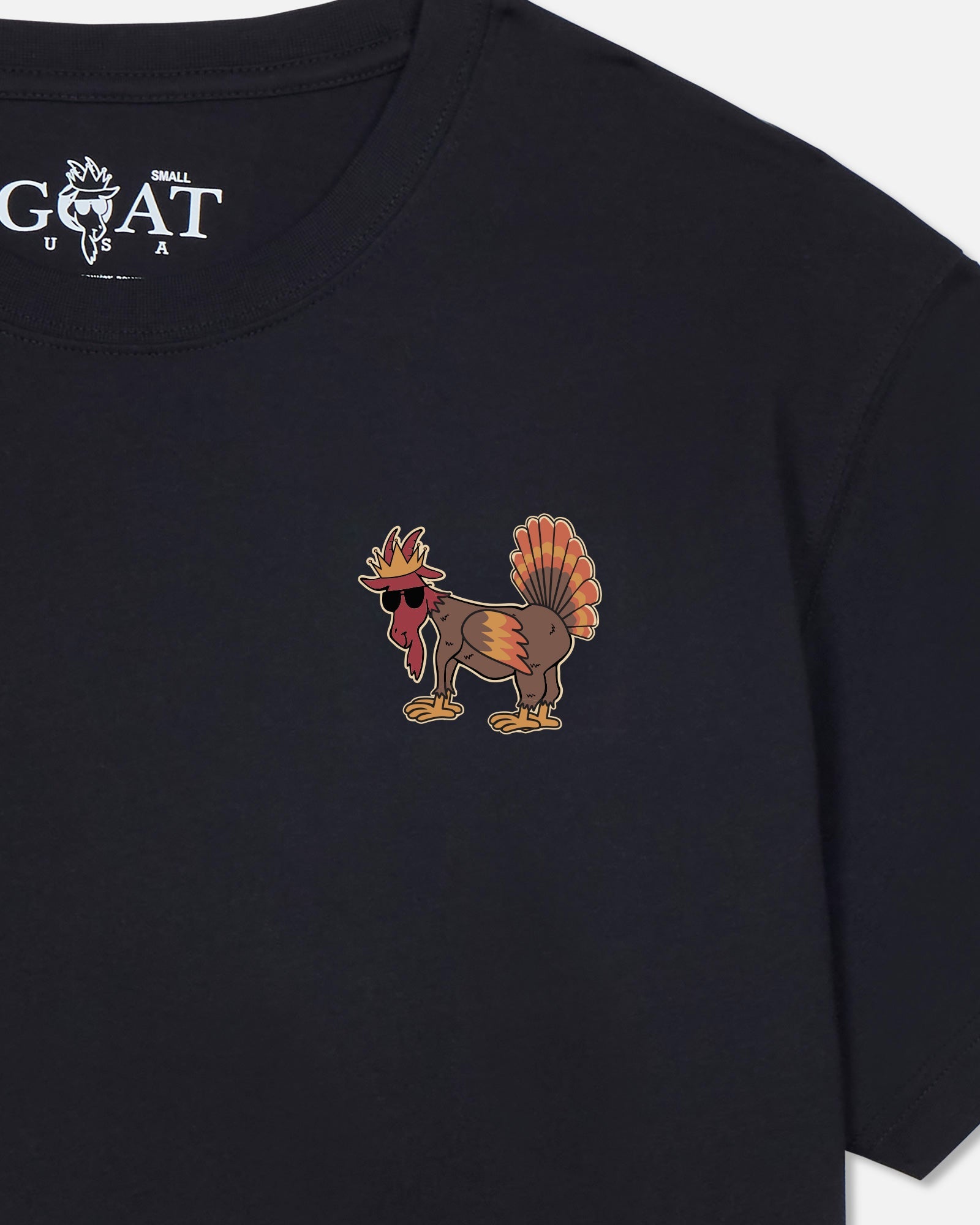 Black t-shirt with a cartoon turkey wearing sunglasses and a crown on the chest.