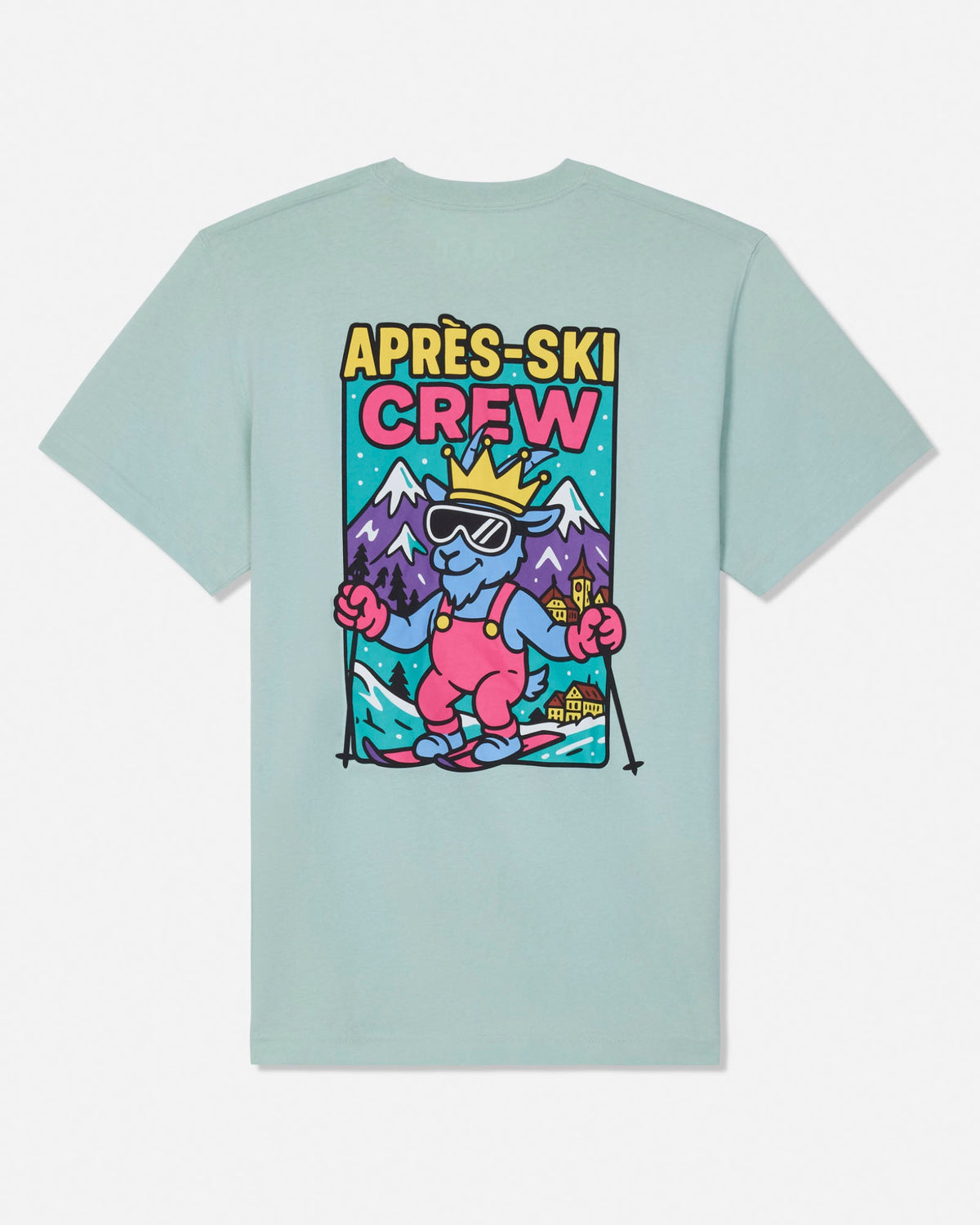 A light mint green crewneck t-shirt with a colorful graphic on the front that reads 'APRÈS-SKI CREW' above an illustration of a cartoon character skiing in front of mountains.