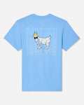 A light blue short-sleeve t-shirt with a graphic on the front featuring a white goat wearing sunglasses and a gold crown, set against a white background with vertical text.