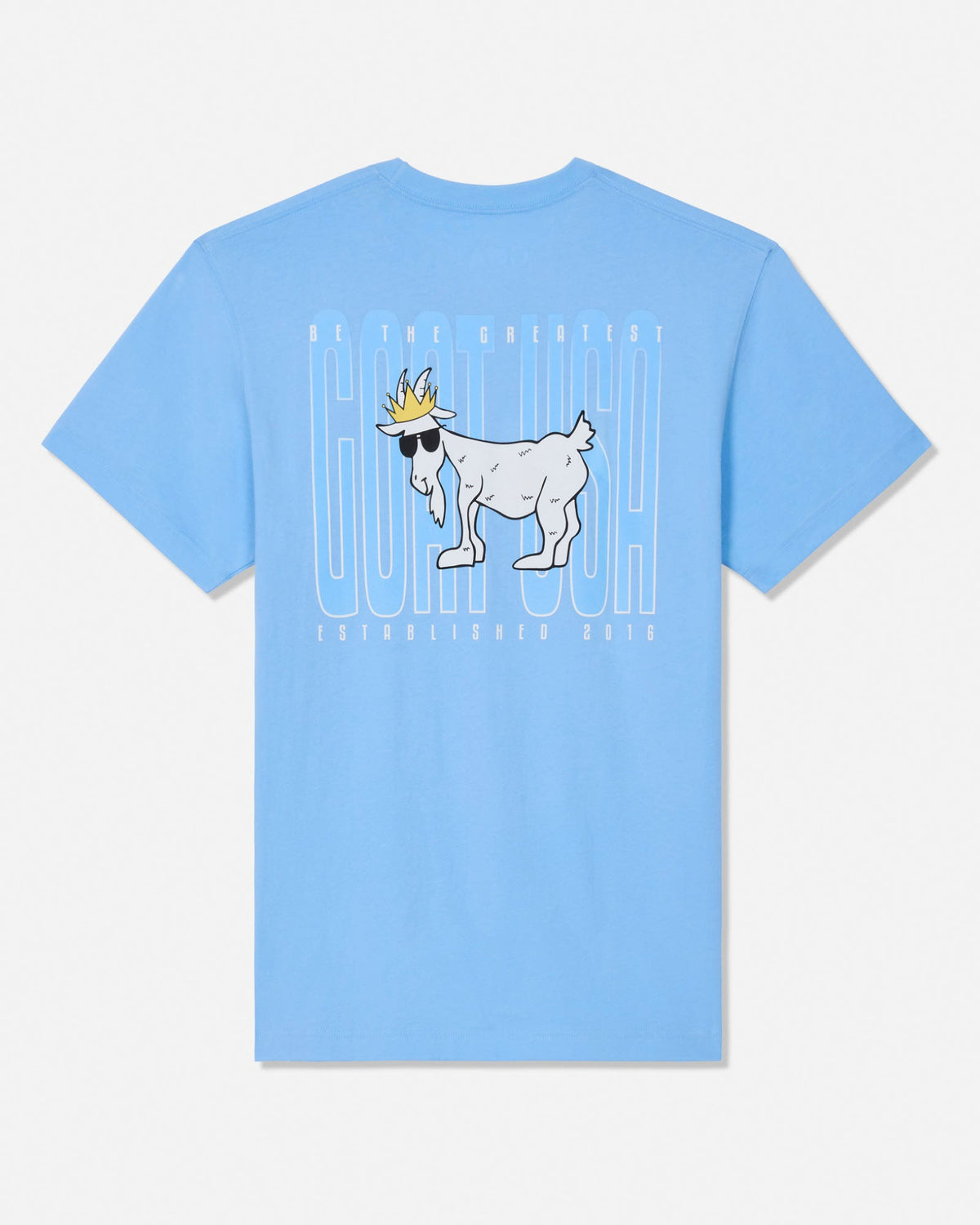 A light blue short-sleeve t-shirt with a graphic on the front featuring a white goat wearing sunglasses and a gold crown, set against a white background with vertical text.