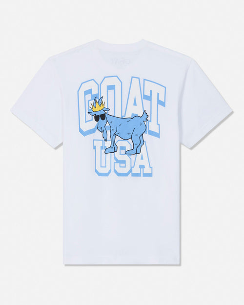 A white short-sleeve t-shirt with a graphic print on the front featuring a blue cartoon goat wearing sunglasses and a gold crown, set against large light blue and white block letters spelling 'GOAT USA'.