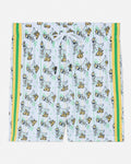 Shorts with a goat pattern and yellow and green stripes on a white background