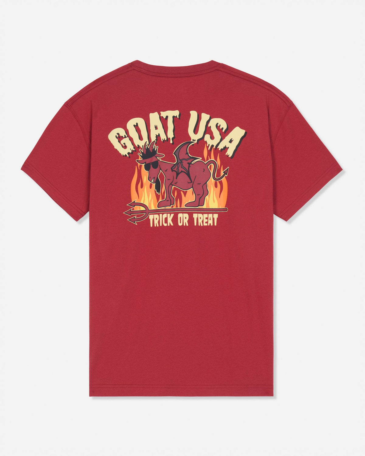 A red short-sleeve t-shirt shown from the back, featuring a large graphic print with the text 'GOAT USA' and 'TRICK OR TREAT' in cream and yellow, surrounding an illustration of a goat in flames.