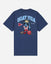 A navy blue short-sleeve t-shirt with a large graphic on the back. The graphic features the text 'GOAT USA' in light blue, a cartoon goat mascot wearing a gold crown and sunglasses, a red football helmet, and a red and white pennant.