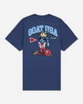 A navy blue short-sleeve t-shirt with a large graphic on the back. The graphic features the text 'GOAT USA' in light blue, a cartoon goat mascot wearing a gold crown and sunglasses, a red football helmet, and a red and white pennant.