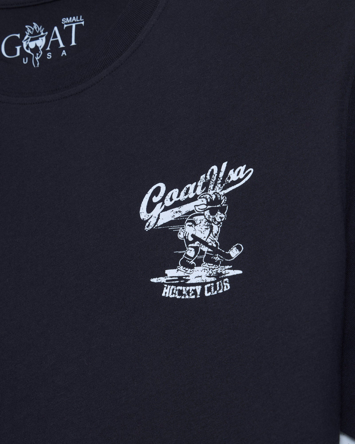 Front of black t-shirt with goat hockey player left-chest graphic
