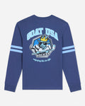 A royal blue long-sleeve t-shirt with a large graphic on the back featuring a cartoon goat hockey player and the text 'GOAT USA HOCKEY'. The sleeves have two light blue stripes, and the shirt is shown against a light gray background.