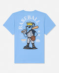 A light blue short-sleeve t-shirt with a large graphic of a cartoon blue-gray goat baseball player wearing a gold crown and sunglasses, holding a bat. The word 'BASEBALL' is printed in arched white letters above the graphic, with 'GOAT USA' printed on the left side of the design.