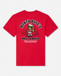 Red t-shirt with green santa cartoon goat character with text that reads "North Pole's Most Wanted"