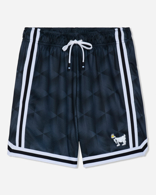 Black athletic shorts with a subtle geometric pattern, featuring white side stripes, a white drawstring, and a small white goat logo with a yellow flower on the lower left leg.#color_black
