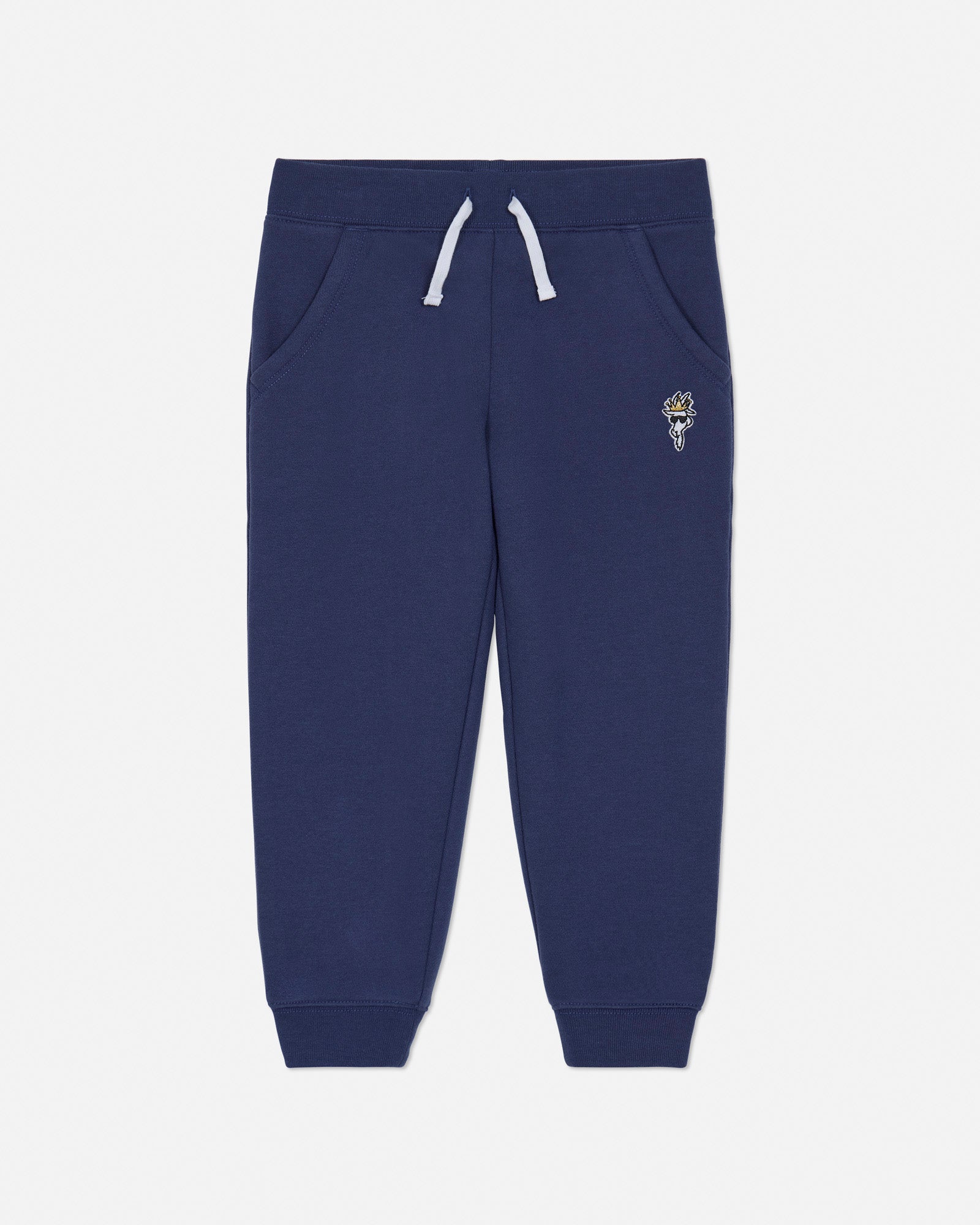 Navy blue sweatpants with a small embroidered design on a white background#color_navy
