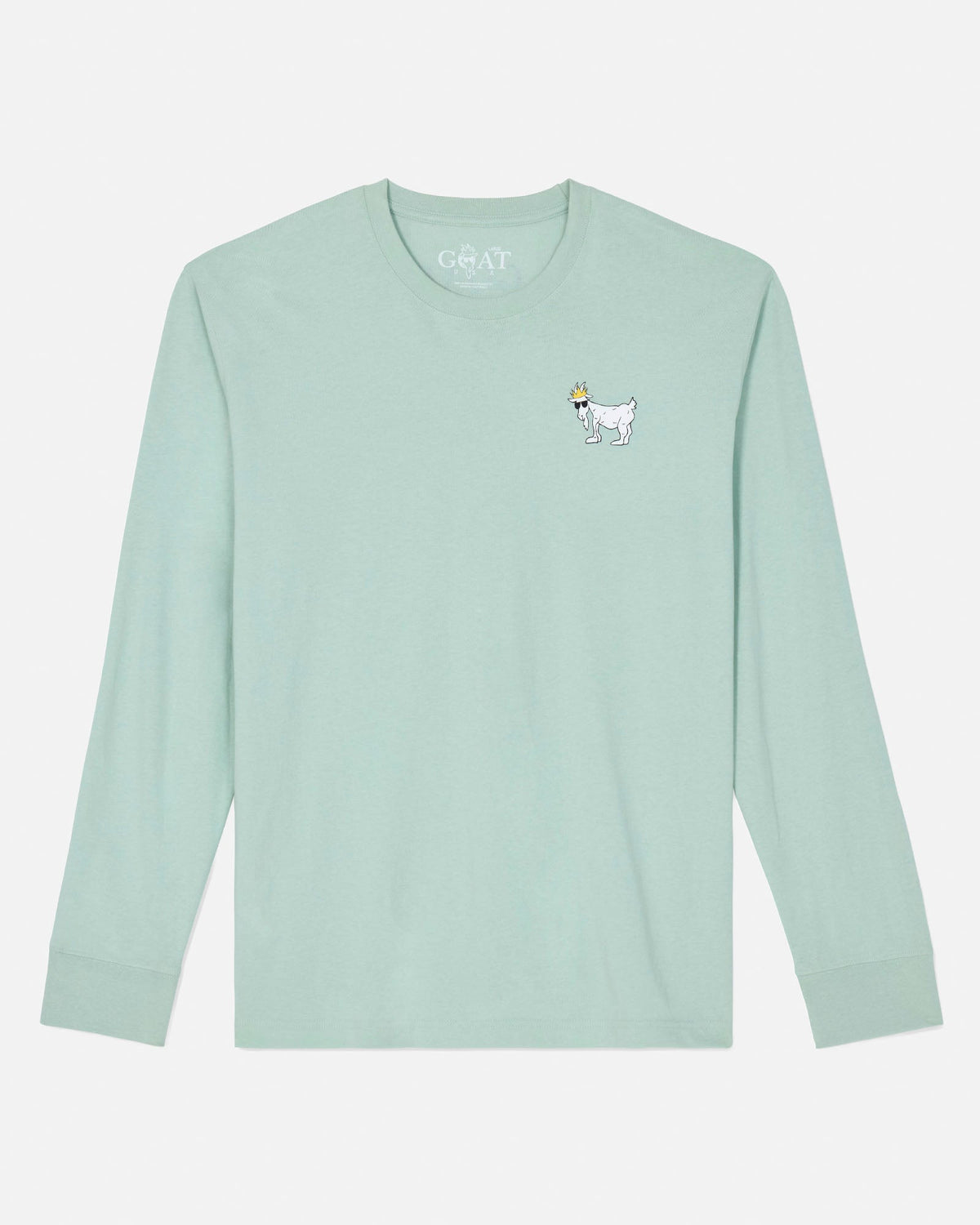 A light mint green long-sleeve crewneck t-shirt by GOAT USA, featuring a small white cartoon goat wearing a gold crown on the left chest, displayed on a clean light gray background.