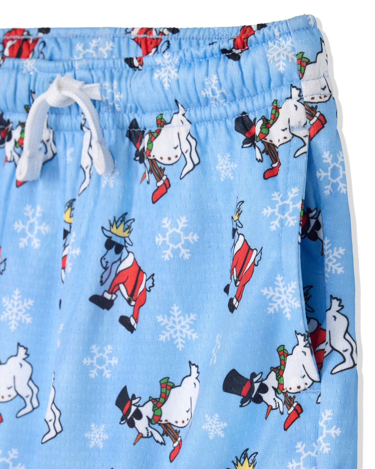 Light blue children's pajama shorts with a white drawstring waist, featuring a festive print of goats in red and green holiday outfits, white snowflakes, and white polar bears.