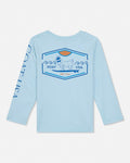 Light blue long-sleeve shirt with a graphic design on the back against a white background