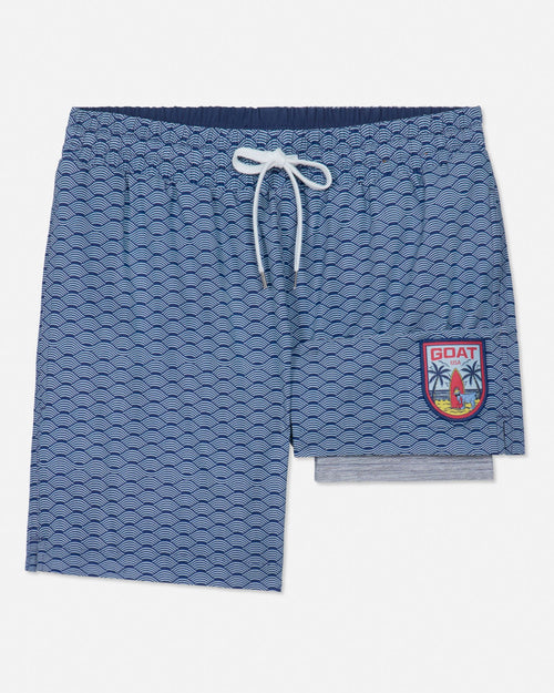 Blue patterned shorts with a logo on a white background