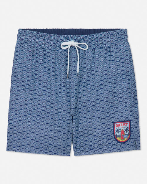 Blue patterned shorts with a logo on a white background