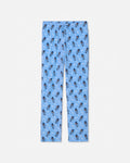 Light blue pajama pants with an all-over repeating pattern of small cartoon goats and white mountain peaks, shown flat against a light gray background.