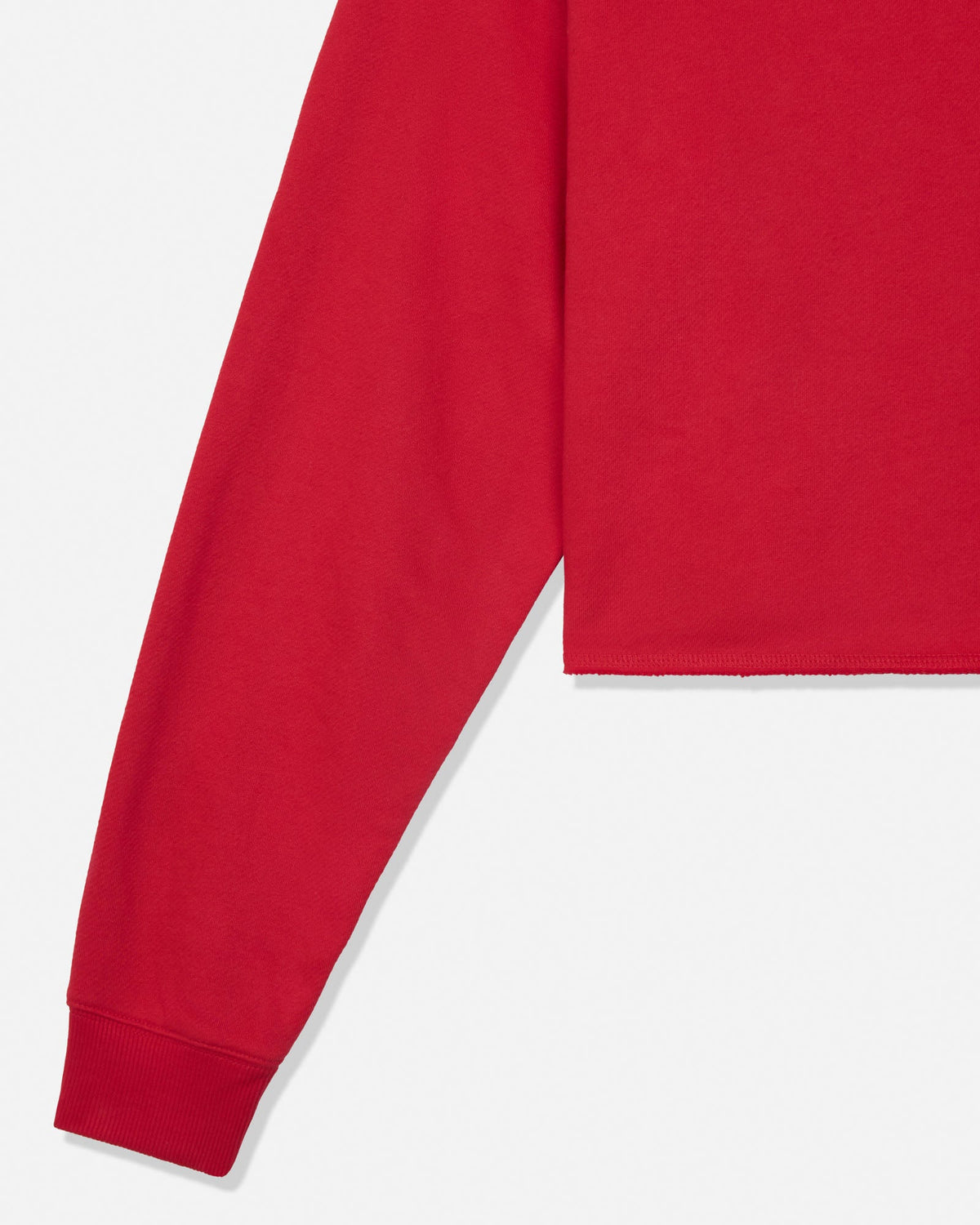 A close-up of a bright red long-sleeve sweatshirt, showing the sleeve, ribbed cuff, and body fabric against a clean white background.