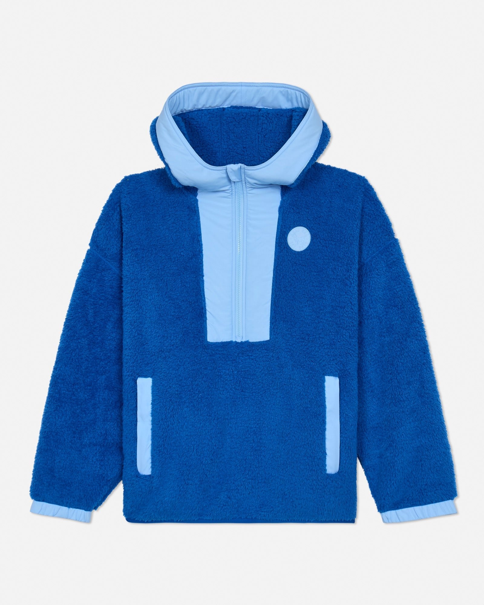 Blue sherpa jacket with light blue accents on a light gray background
