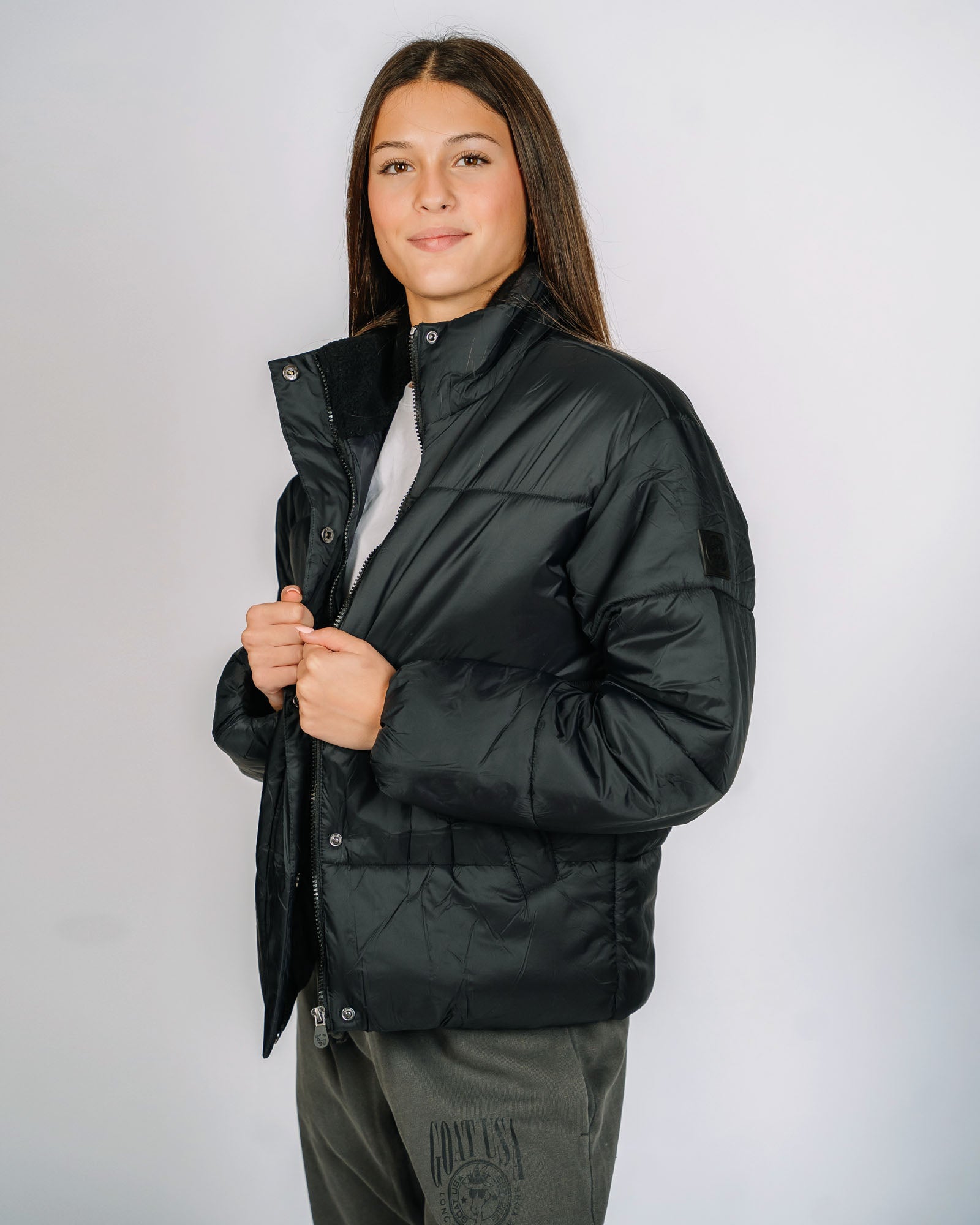 Female model wearing black puffer jacket - top only#color_black