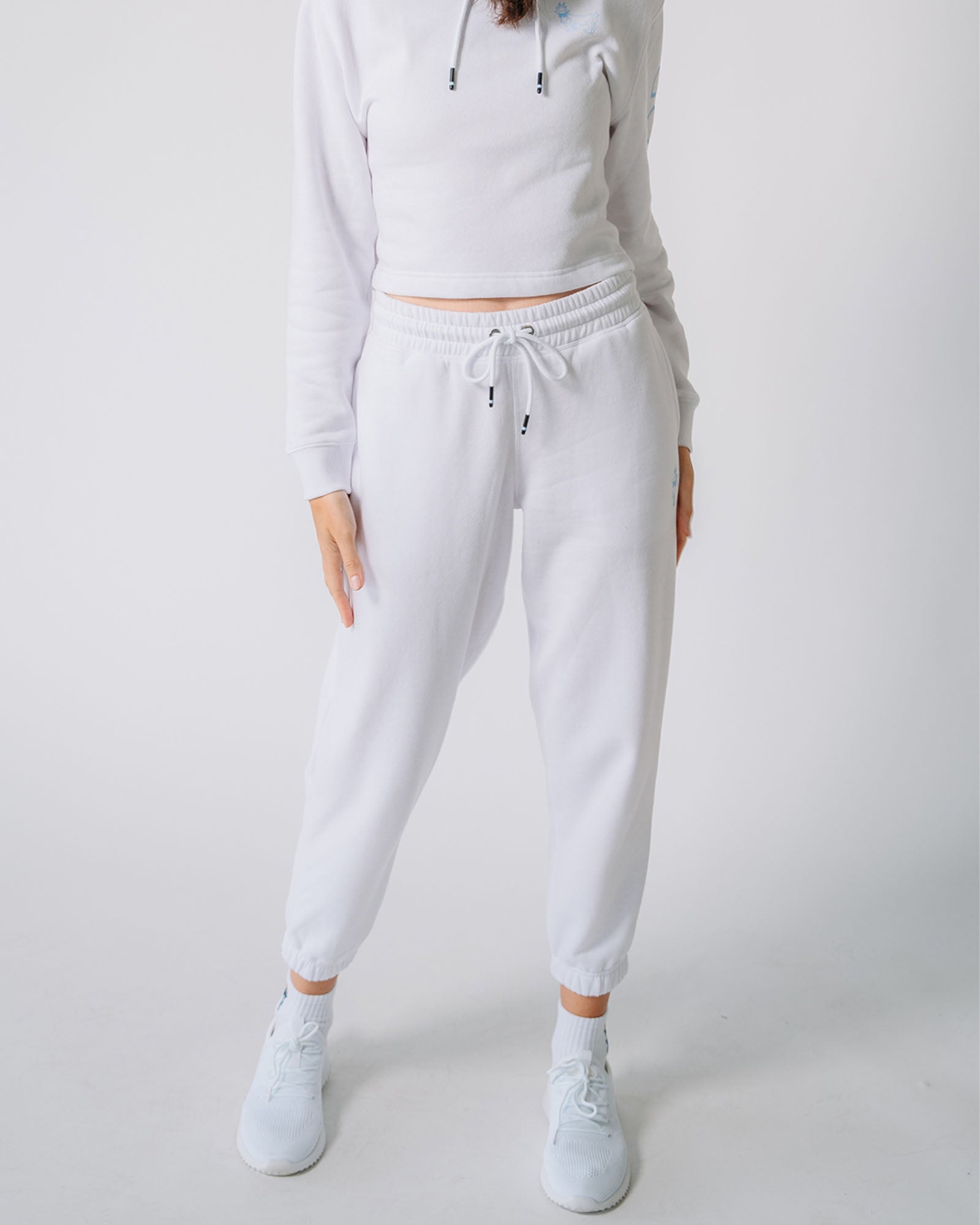 Model wearing white Women's Scrunch Joggers#color_white