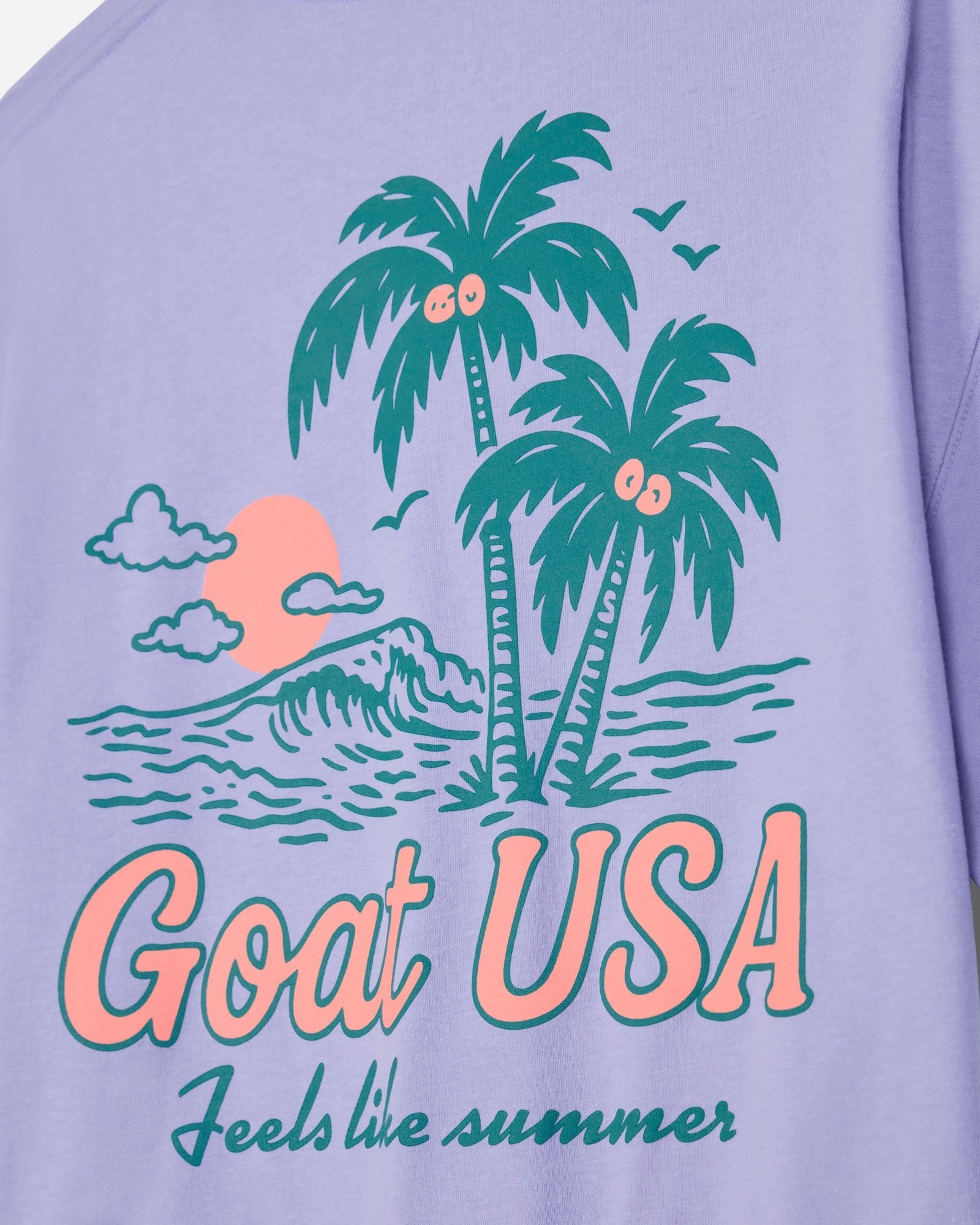 Periwinkle crop tee with 'Goat USA' and beach graphic design