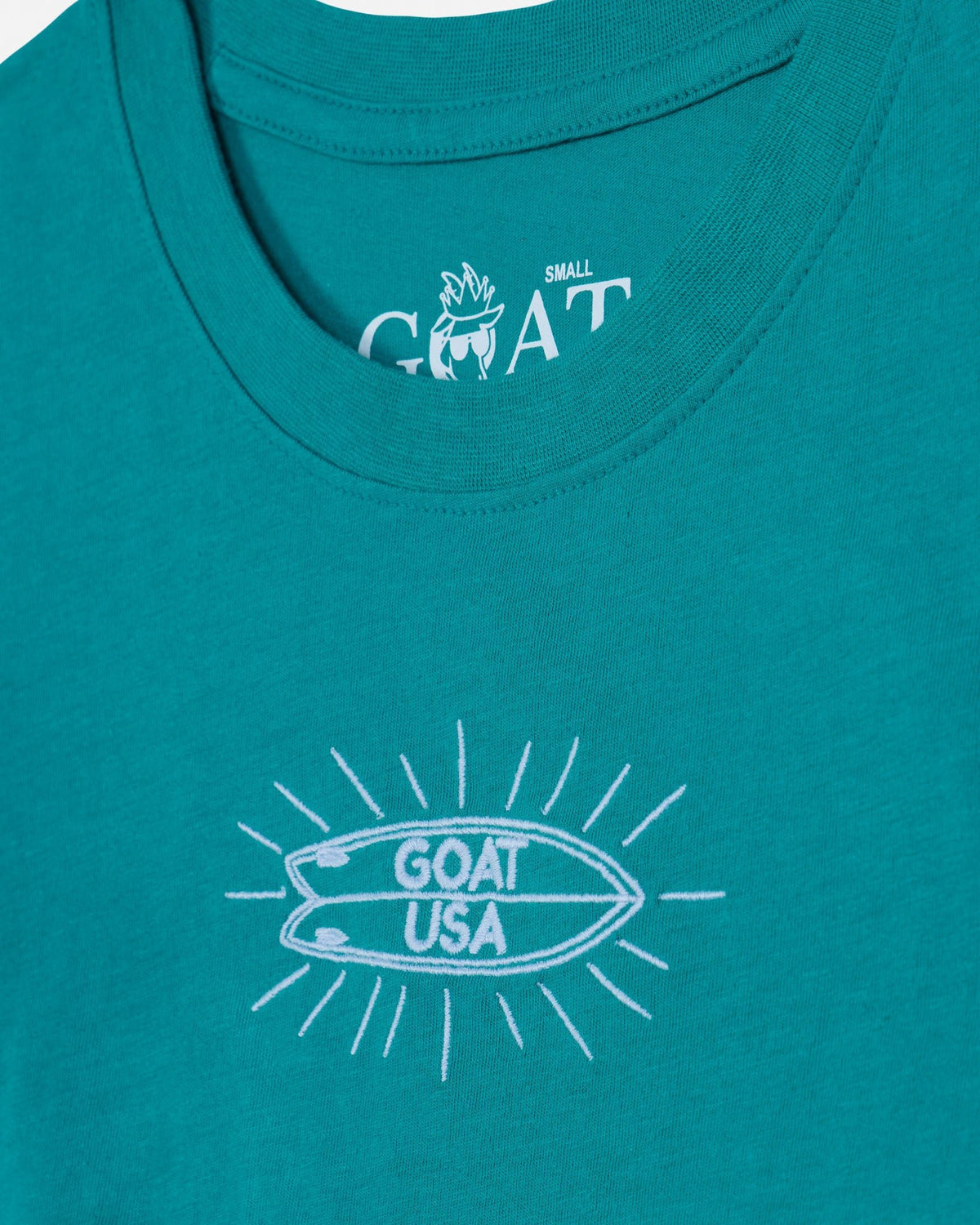 Teal tank top with white graphic and 'GOAT USA' text
