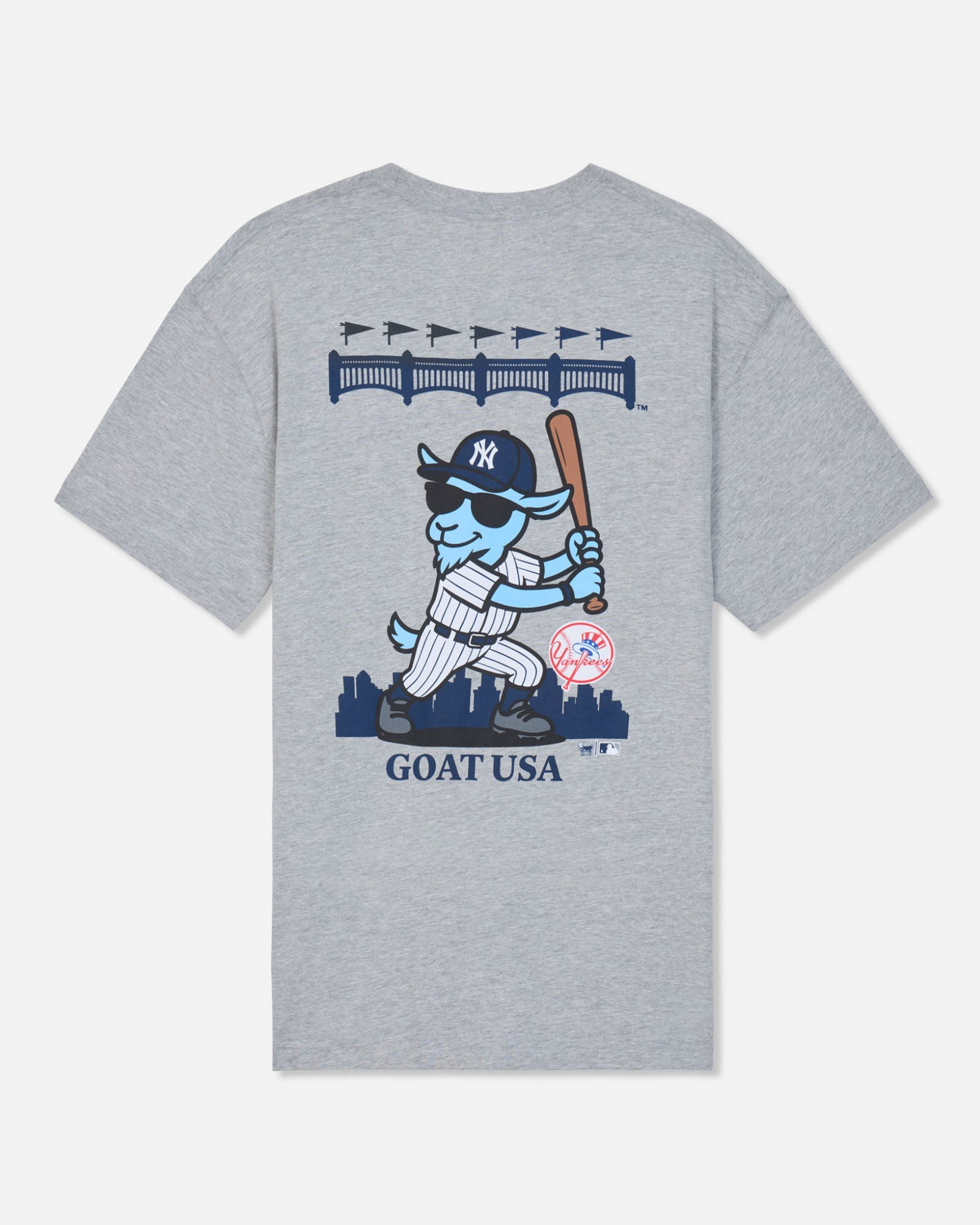 A heather gray short-sleeve t-shirt with a large graphic on the front featuring a cartoon blue goat in a New York Yankees uniform holding a bat, with 'GOAT USA' printed below.#color_gray