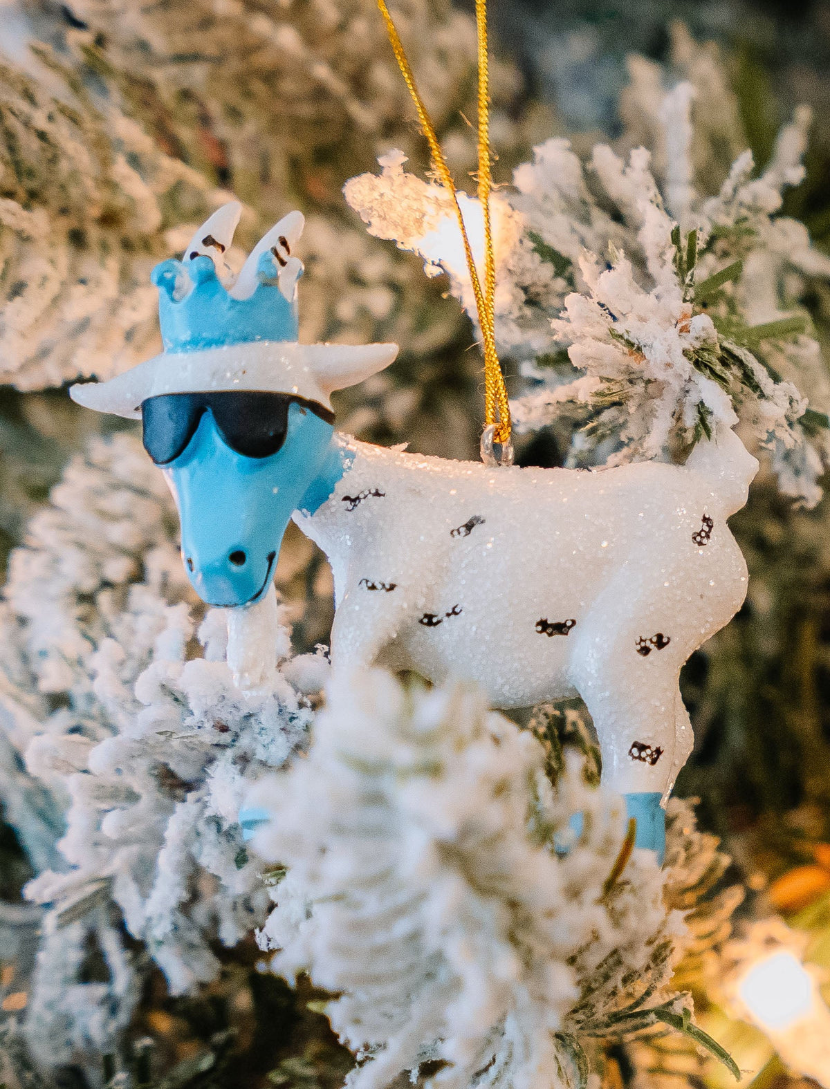 Yeti goat ornament hanging on a tree